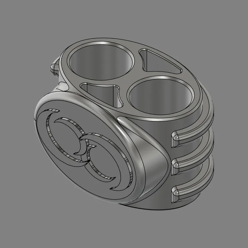 CAD model of a Moonchucks design: a rounder oval body with two round holes and two triangular openings in the top, two crescent moons on the front and three ridges down one side.
