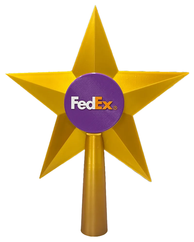 Yellow five-point star Christmas tree topper with a purple center disc carrying the FedEx logo, on a tapered gold socket.